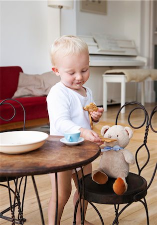 Boy toddler at tea party with his teddy Stock Photo - Premium Royalty-Free, Code: 649-03292610