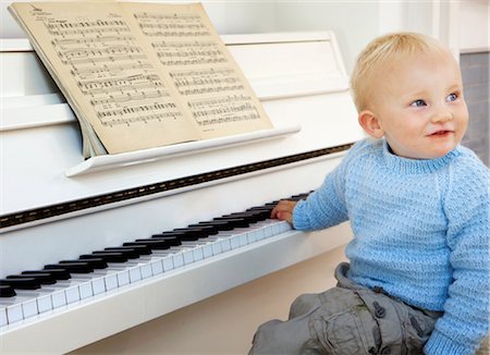 piano practice - A boy toddler sitting at the piano Stock Photo - Premium Royalty-Free, Code: 649-03292630