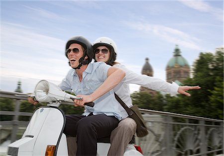 friends driving - couple on scooter Stock Photo - Premium Royalty-Free, Code: 649-03292778