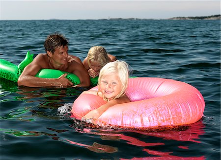 Girl on inflatable ring Stock Photo - Premium Royalty-Free, Code: 649-03292895