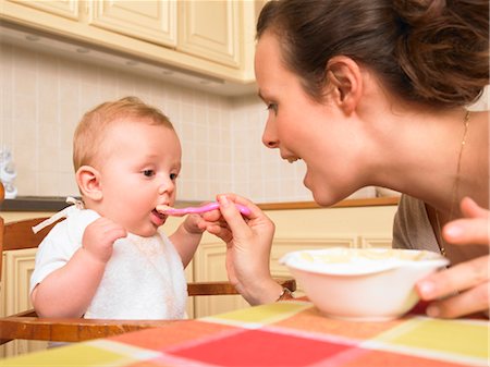 simsearch:614-05955650,k - mother feeding baby Stock Photo - Premium Royalty-Free, Code: 649-03293636