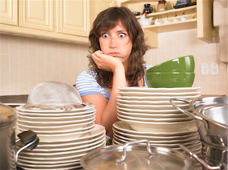 woman with piles of washing up Stock Photo - Premium Royalty-Free, Code: 649-03293643