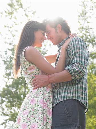 smile woman sun rays - couple under trees Stock Photo - Premium Royalty-Free, Code: 649-03293897