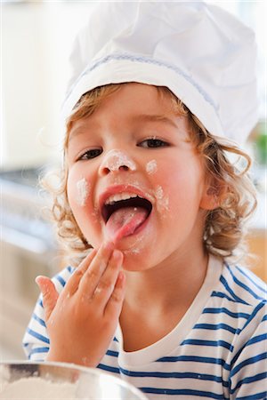 fun with flour - Young boy tasting dough Stock Photo - Premium Royalty-Free, Code: 649-03362621