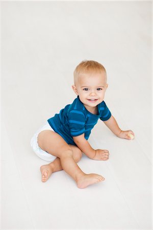 baby sitting on floor in diapers Stock Photo - Premium Royalty-Free, Code: 649-03362699