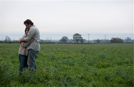 support, nature - couple hugging in field Stock Photo - Premium Royalty-Free, Code: 649-03362796