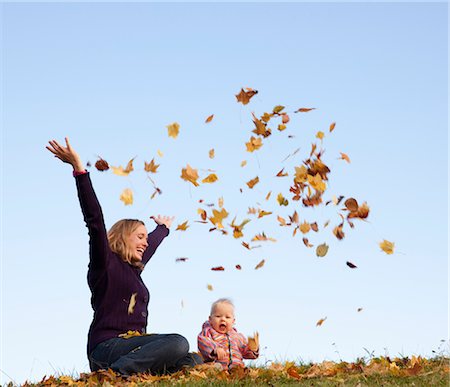 simsearch:673-06964589,k - mother and baby throwing autumn leaves Stock Photo - Premium Royalty-Free, Code: 649-03362908