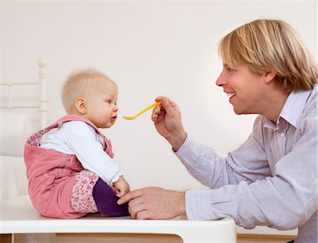 simsearch:649-05656972,k - father feeding baby Stock Photo - Premium Royalty-Free, Code: 649-03362940