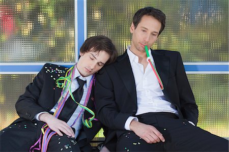 drunk passed out - two businessmen at bus stop after party Stock Photo - Premium Royalty-Free, Code: 649-03363048