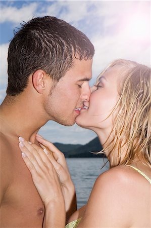 simsearch:649-05556305,k - A young couple kissing each other Stock Photo - Premium Royalty-Free, Code: 649-03363224