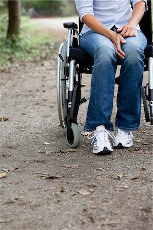 Woman in a wheelchair Stock Photo - Premium Royalty-Free, Code: 649-03363301