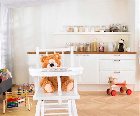 childrens toys in kitchen Stock Photo - Premium Royalty-Free, Code: 649-03418215