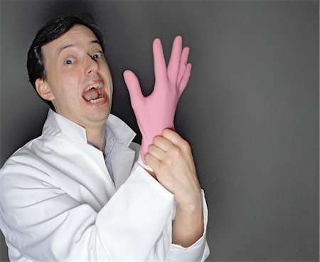 simsearch:649-06717567,k - man putting rubber glove on Stock Photo - Premium Royalty-Free, Code: 649-03418423
