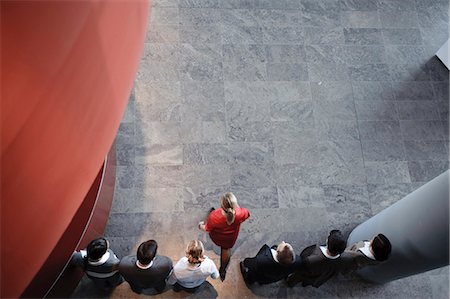 standing concept individuality concept - Woman is making first step in a row Stock Photo - Premium Royalty-Free, Code: 649-03447434