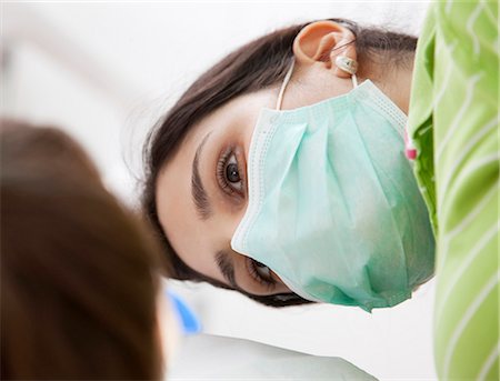 Dentist with patient in surgery Stock Photo - Premium Royalty-Free, Code: 649-03487172