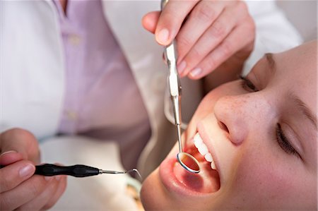 pickaxe - Dentist checking patient's teeth Stock Photo - Premium Royalty-Free, Code: 649-03487181