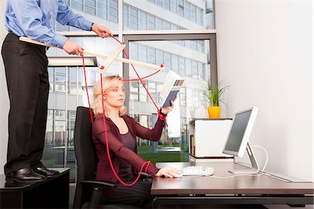 string (not clothing, packaging or instruments) - Boss coordinating employee at desktop Stock Photo - Premium Royalty-Free, Code: 649-03487455