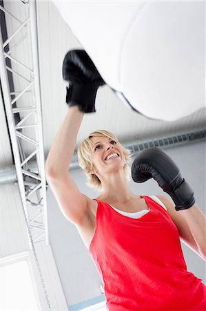 simsearch:649-06041783,k - Woman boxing punching bag Stock Photo - Premium Royalty-Free, Code: 649-03510811