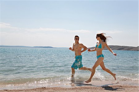 simsearch:649-03009497,k - Couple running at beach Stock Photo - Premium Royalty-Free, Code: 649-03511075