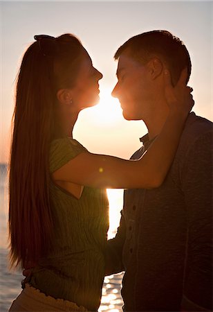 simsearch:649-03796564,k - Couple kissing at beach Stock Photo - Premium Royalty-Free, Code: 649-03511102