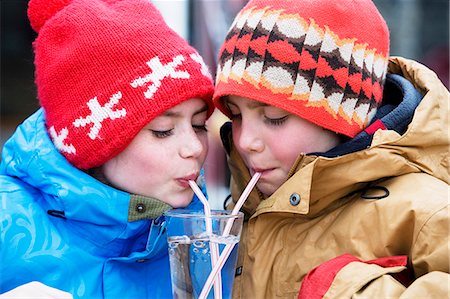 Two children drinking glass of water Stock Photo - Premium Royalty-Free, Code: 649-03565904