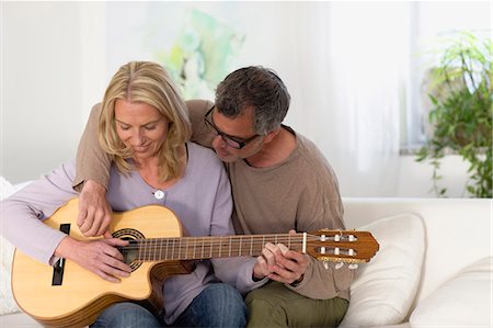 simsearch:614-06719795,k - Man and woman strumming guitar Stock Photo - Premium Royalty-Free, Code: 649-03566015