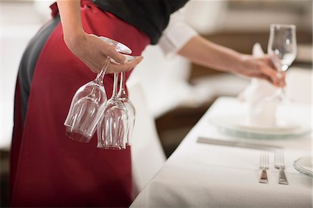 fine dining restaurant - Waitress laying the table Stock Photo - Premium Royalty-Free, Code: 649-03566056