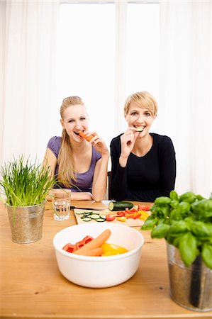 friends cooking inside - Young Women Preparing Food, eating Stock Photo - Premium Royalty-Free, Code: 649-03566130