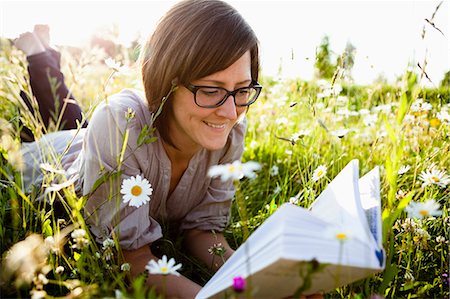 simsearch:400-03934248,k - Woman reading book in wild meadows Stock Photo - Premium Royalty-Free, Code: 649-03566168