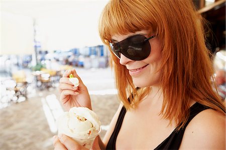 enjoy ice cream - Young woman eating ice cream Stock Photo - Premium Royalty-Free, Code: 649-03606099