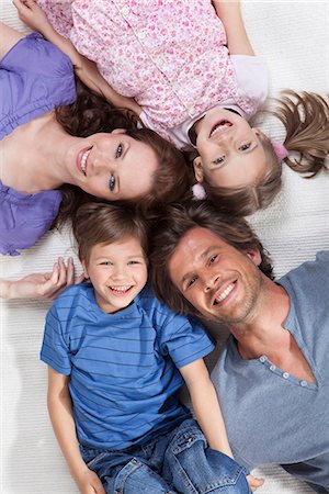 simsearch:649-06717264,k - Happy family lying on rug Stock Photo - Premium Royalty-Free, Code: 649-03606618