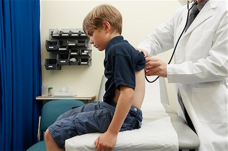 respiration (medical assisted breathing) - Doctor examining young boy Stock Photo - Premium Royalty-Free, Code: 649-03621623