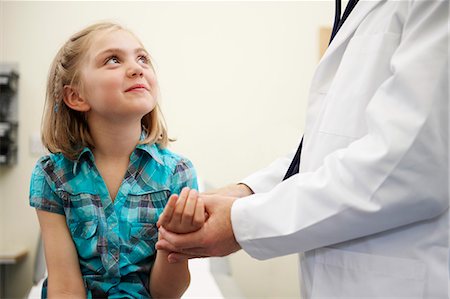 preteen girl with doctor - Young girl and doctor Stock Photo - Premium Royalty-Free, Code: 649-03621635