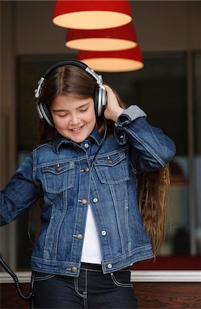 preteen dancing - Young girl listening on headphones Stock Photo - Premium Royalty-Free, Code: 649-03621837