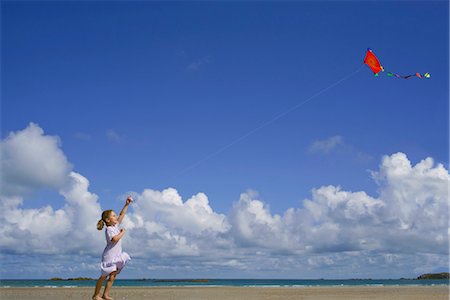 summer picture with kite - Girl flying a kite Stock Photo - Premium Royalty-Free, Code: 649-03622288