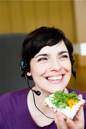 woman in office having a snack Stock Photo - Premium Royalty-Free, Code: 649-03666064