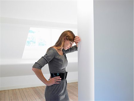 Woman in an empty room Stock Photo - Premium Royalty-Free, Code: 649-03666391