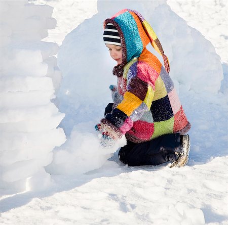 boy building igloo in the snow Stock Photo - Premium Royalty-Free, Code: 649-03666659