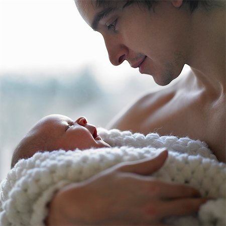 simsearch:6113-07543205,k - Father holding baby in his arms Stock Photo - Premium Royalty-Free, Code: 649-03666787