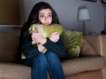 Girl, 14 watching sad movie Stock Photo - Premium Royalty-Free, Code: 649-03667149