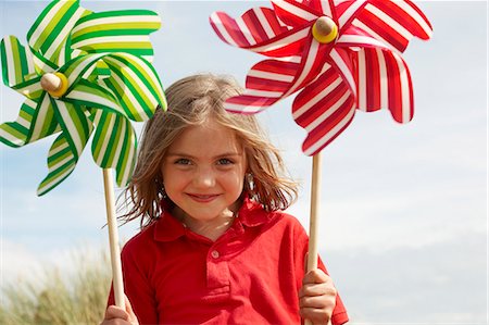 Portrait of girl with windmills Stock Photo - Premium Royalty-Free, Code: 649-03768913