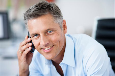 simsearch:649-06041170,k - Man in office phoning Stock Photo - Premium Royalty-Free, Code: 649-03769162
