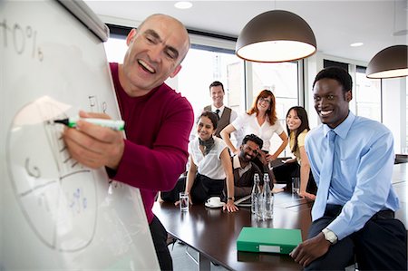 pictures of black people in boardroom meeting - Presentation during business meeting Stock Photo - Premium Royalty-Free, Code: 649-03769404