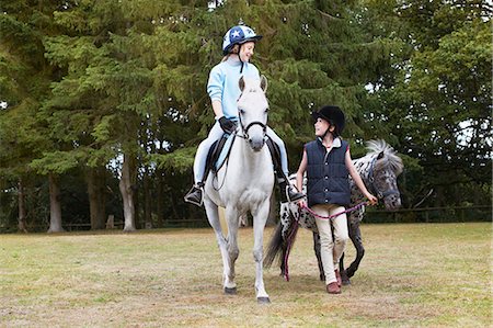 pony human - Two girls out riding ponies Stock Photo - Premium Royalty-Free, Code: 649-03774589