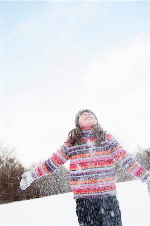 simsearch:649-06112626,k - Girl standing in flurry of snow Foto de stock - Sin royalties Premium, Código: 649-03774900
