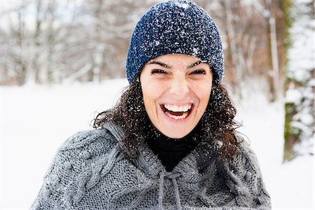 simsearch:649-06112583,k - Woman in snow laughing Foto de stock - Sin royalties Premium, Código: 649-03774913