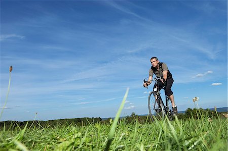 simsearch:625-00801301,k - Man cycling in the country Stock Photo - Premium Royalty-Free, Code: 649-03770472
