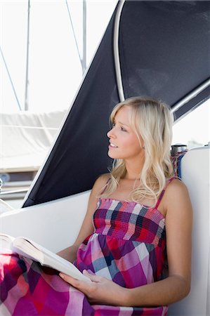 simsearch:700-00357729,k - Girl reading on boat Stock Photo - Premium Royalty-Free, Code: 649-03770483
