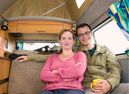 Happy couple sit in camper van Stock Photo - Premium Royalty-Free, Code: 649-03770573