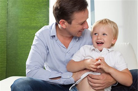 simsearch:649-03770663,k - Father hugging son Stock Photo - Premium Royalty-Free, Code: 649-03770664